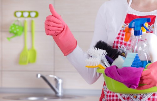 Cleaner preparing a kitchen and living space in W1J