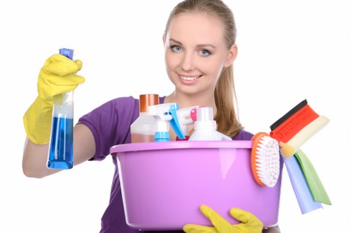 Technician monitoring carpet cleaning process in a controlled workspace